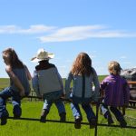 Ava Kendall, Cameron Davidson, Chloe Kendall and Jaime Davidson take a break from branding calves on the Bar AV Ranch south of Ponteix, Sask.
