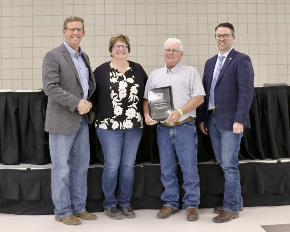 Chad Nicholas, Canadian Hereford Association president, Jackie and Wally Mitchell and Michael Latimer, Canadian Hereford Association executive director.