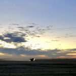A combine in the Interlake runs against the setting sun on Nov. 1, 2022, in an effort to wrap up harvest. Photo: Greg Berg