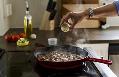 ground beef cooking in a pan on a stovetop
