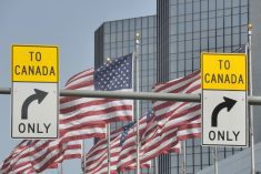 Canada/U.S. border signage in downtown Detroit. (RiverNorthPhotography/Getty Images)
