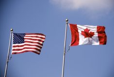 American and Canadian flag flying side by side.