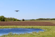a drone flying over a farm field