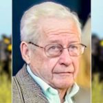 photo of Jack Anderson with a herd of cattle in the background