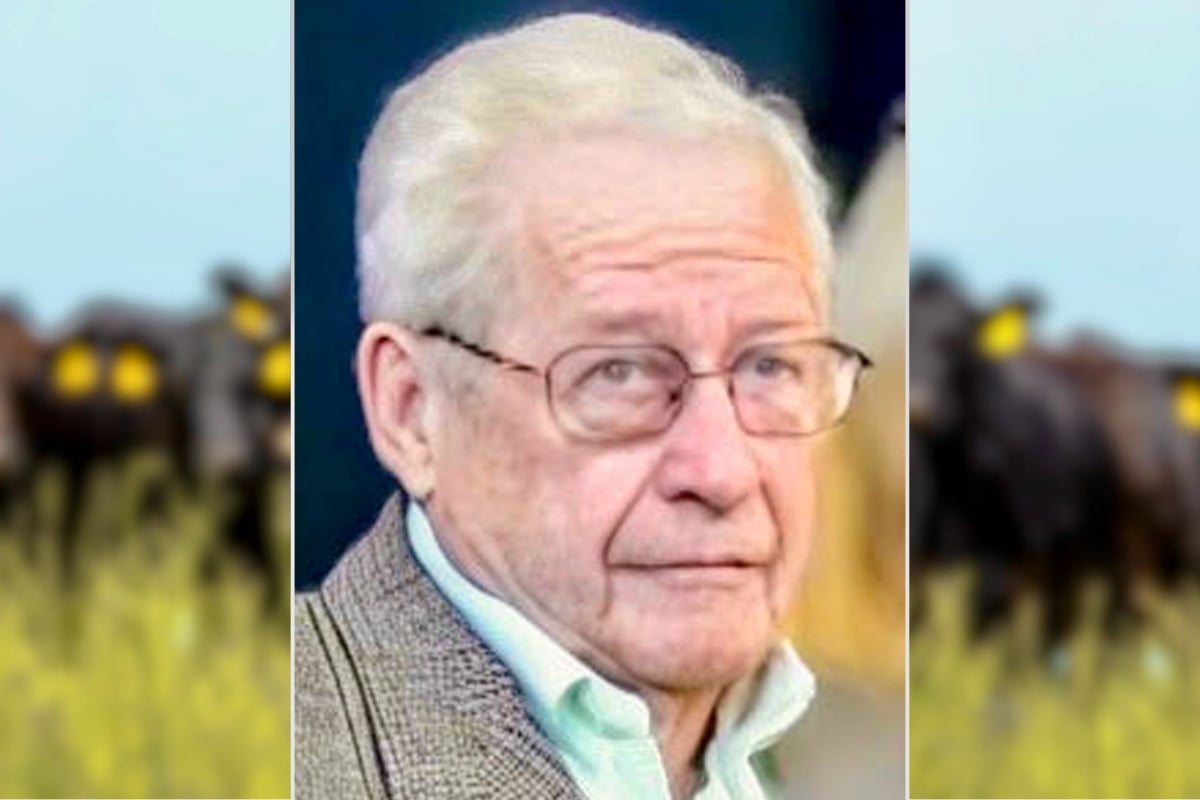 photo of Jack Anderson with a herd of cattle in the background