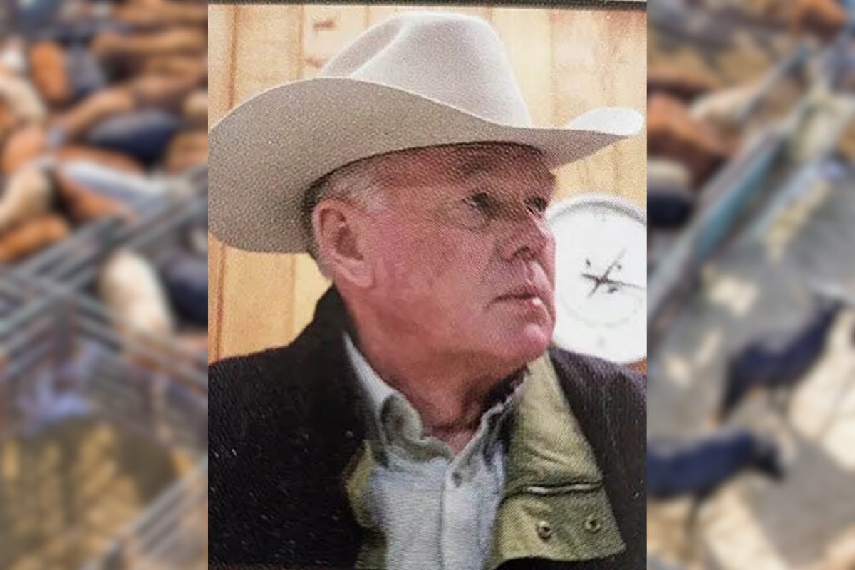 photo of Dennis Johnston wearing a white cowboy hat