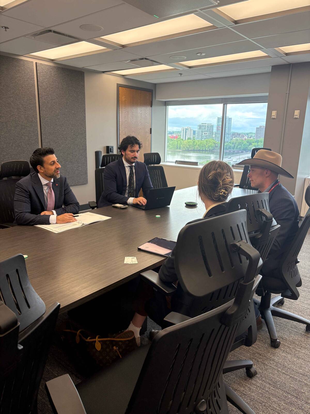 The CCA's Jennifer Babcock and Tyler Fulton meeting with Maninder Sidhu, minister of international trade. Photo: Canadian Cattle Association