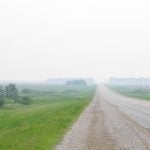 Smoke from wildfires blankets farm fields in central Manitoba June 9, 2025.