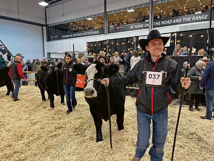 Wheatland Lady 211H, with calf Wheatland Bull 4177M, was named Supreme female at Canadian Western Agribition 2024. The heifer was owned by the Wheatland Cattle Co. in Bienfait, Sask., Michelson Land & Cattle and G2 Cattle Co. Riley Lafrentz is in the foreground leading the cow and his wife, Madison, leads the bull calf.