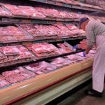 Butcher stocks meat at a grocery store in Mississauga, Ontario, Canada on November 11, 2022. The majority of respondents in a Canada-wide survey said they are using coupons or hunting for sales to cope with increasing food costs. Nearly 20 per cent were also reducing meal sizes or skipping meals altogether in order to save money. Nearly five per cent of those surveyed said they had stolen food out of necessity, and about five per cent had used a food bank or community fridge. Statistics Canada's consumer price index report said while the country's annual inflation rate dropped slightly to 6.9 per cent in September, the cost of groceries continued to climb. Grocery prices increased at the fastest rate since August 1981, with prices up 11.4 per cent compared to a year ago. (Photo by Creative Touch Imaging Ltd./NurPhoto)