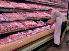Butcher stocks meat at a grocery store in Mississauga, Ontario, Canada on November 11, 2022. The majority of respondents in a Canada-wide survey said they are using coupons or hunting for sales to cope with increasing food costs. Nearly 20 per cent were also reducing meal sizes or skipping meals altogether in order to save money. Nearly five per cent of those surveyed said they had stolen food out of necessity, and about five per cent had used a food bank or community fridge. Statistics Canada's consumer price index report said while the country's annual inflation rate dropped slightly to 6.9 per cent in September, the cost of groceries continued to climb. Grocery prices increased at the fastest rate since August 1981, with prices up 11.4 per cent compared to a year ago. (Photo by Creative Touch Imaging Ltd./NurPhoto)